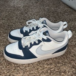 Blue and white Nikes